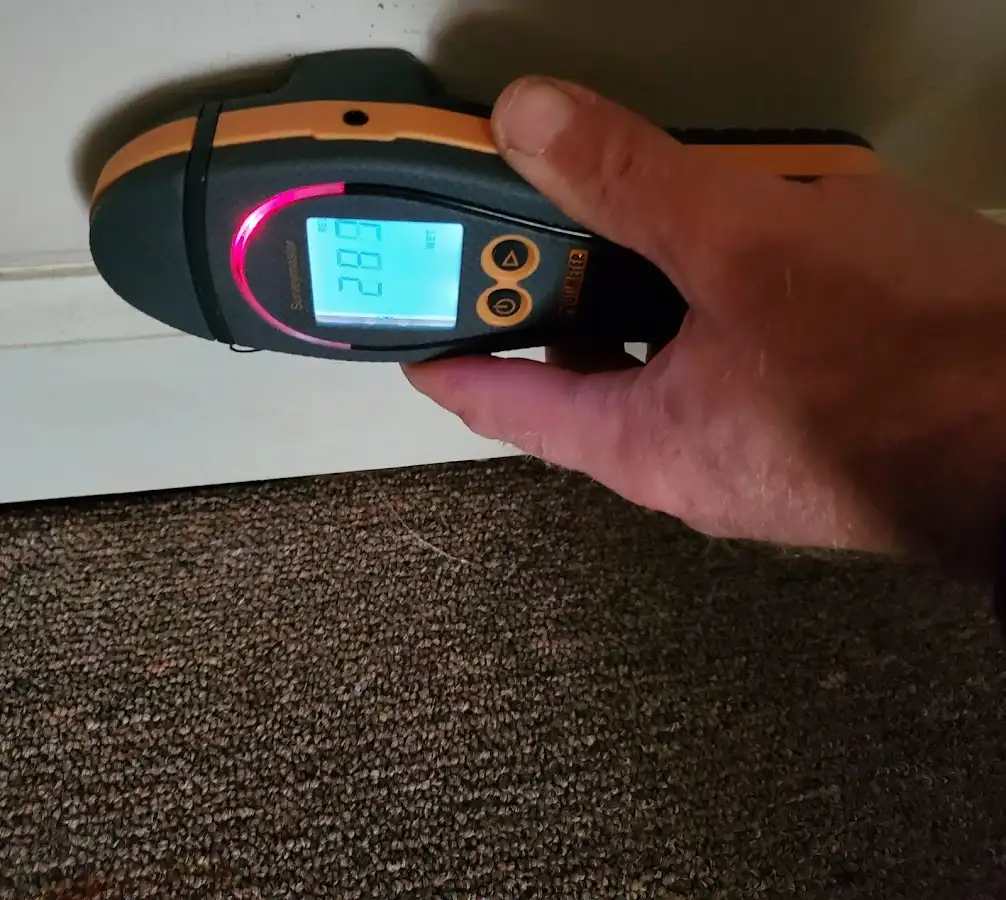 Moisture detection at baseboard during Storm Damage Restoration in Kimberly